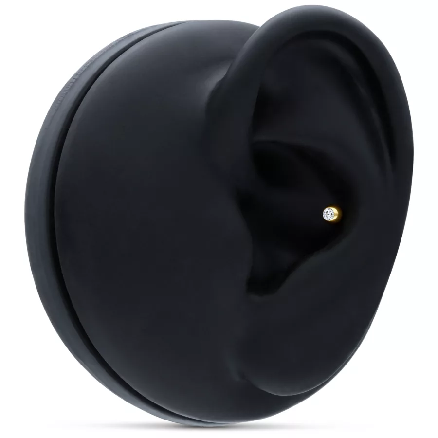 Cono d'oro 18k con pietra cristallina su display nero per orecchio