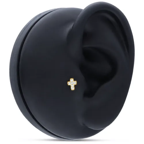 Attacco a croce dorato con cristalli su display nero per orecchio