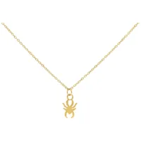 Collana dorata con piccolo ciondolo a forma di ragno su sfondo bianco