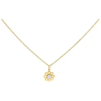 Collana dorata con ciondolo a forma di fiore di cristallo su sfondo bianco