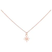 Delicata collana Polar Star in acciaio chirurgico in oro rosa su sfondo bianco