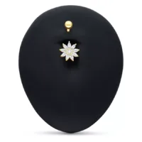 Piercing all'ombelico in oro 18k con fiore di cristallo chiaro su sfondo nero