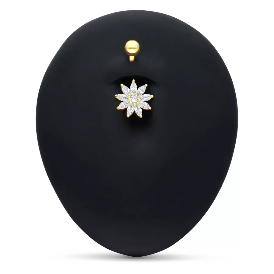 Piercing all'ombelico in oro 18k con fiore di cristallo chiaro su sfondo nero