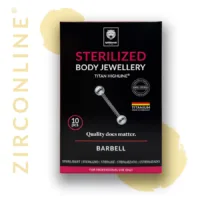 Micro Barbell dorato in titanio su sfondo nero, confezione visibile