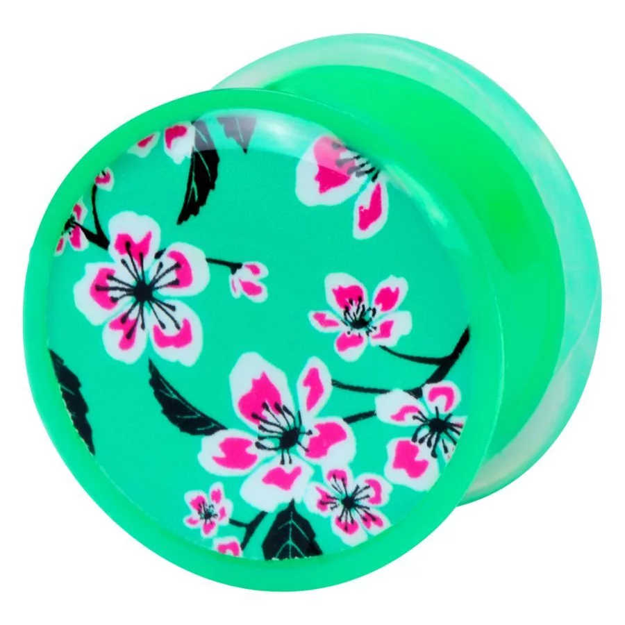 Plug verde con motivo floreale rosa su sfondo bianco