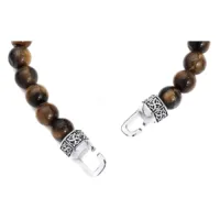 Bracciale con pietre marroni e chiusura argentata su sfondo bianco