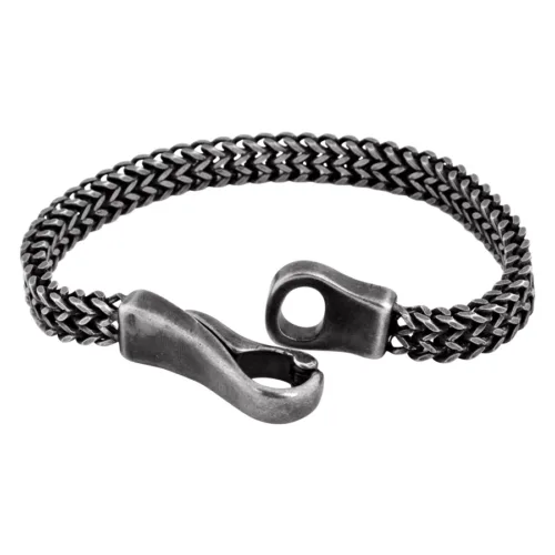 Bracciale nero opaco con motivo in pizzo in acciaio chirurgico su sfondo bianco