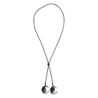 Collana unisex nera con due ciondoli a forma di luna e volto su sfondo bianco