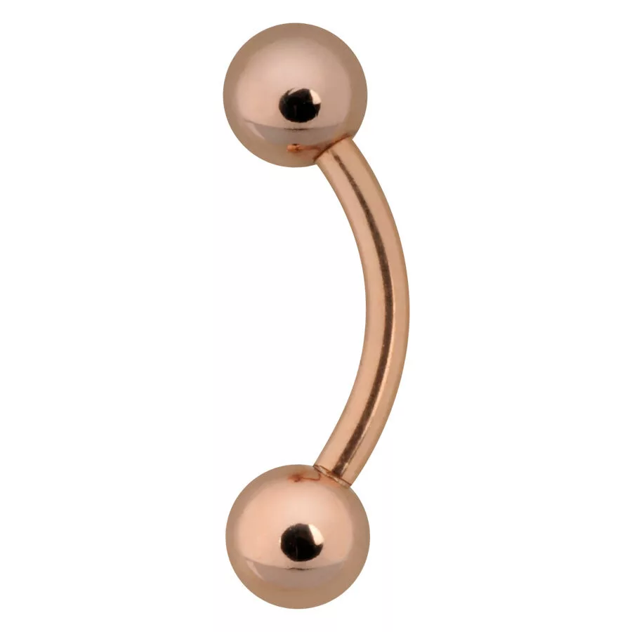 Piercing all'ombelico in oro rosa con due sfere su sfondo bianco