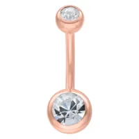 Piercing all'ombelico in oro rosa con due cristalli chiari su sfondo bianco