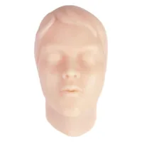 Forma del viso in silicone beige per esercitazioni di tatuaggio su sfondo bianco