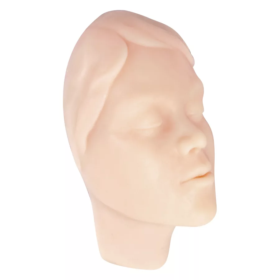 Modello in silicone beige di un volto femminile per esercitazioni di tatuaggio, in posizione laterale