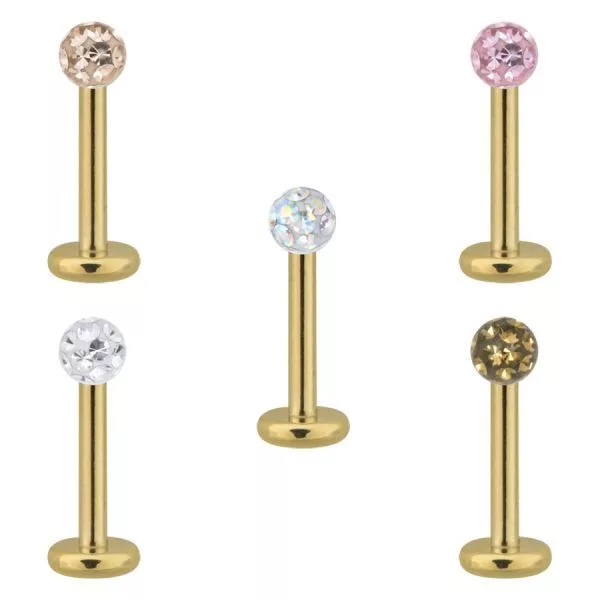 Fünf goldene Titan Labrets mit klaren und bunten Kristallen auf weißem Hintergrund