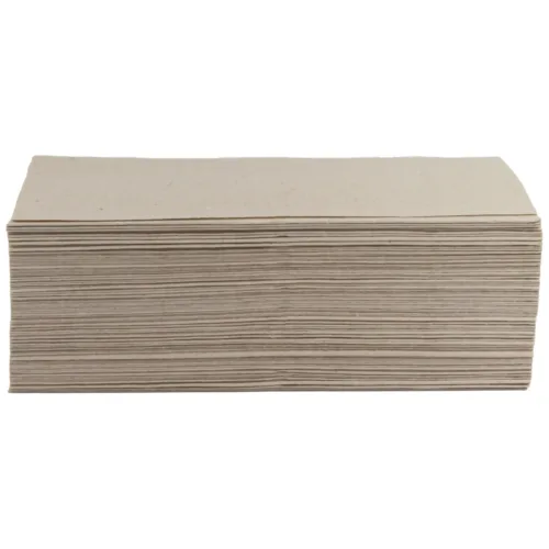 Asciugamano monostrato beige piegato su sfondo bianco