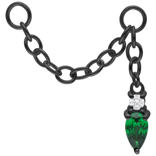 Collana piercing nera con cristallo verde smeraldo su sfondo bianco