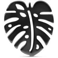 Orecchini Monstera neri in acciaio chirurgico lucido su sfondo bianco