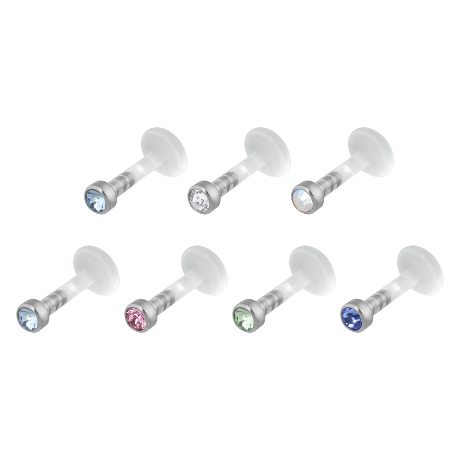 Sei labret push-fit con cristalli in vari colori su sfondo bianco