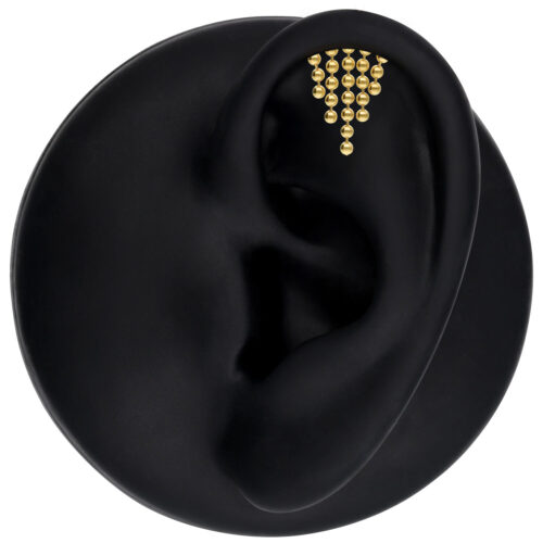 Attacco Helix dorato per l'orecchio con cristalli chiari su sfondo nero