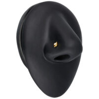 Piercing nasale in oro 18K con cristallo Piercing nasale in oro 18K con cristallo chiaro su sfondo nero