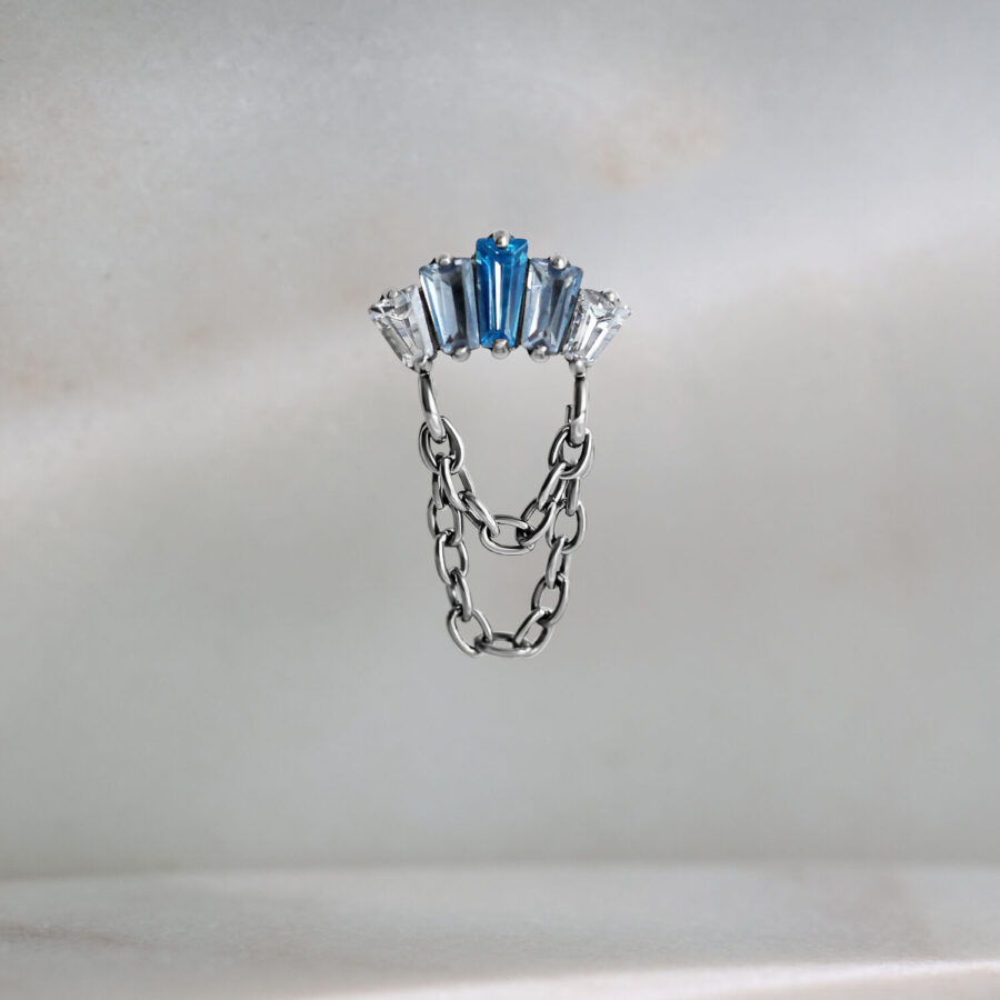 Accessorio Push Fit argento con cristalli lavanda e turchese su sfondo chiaro