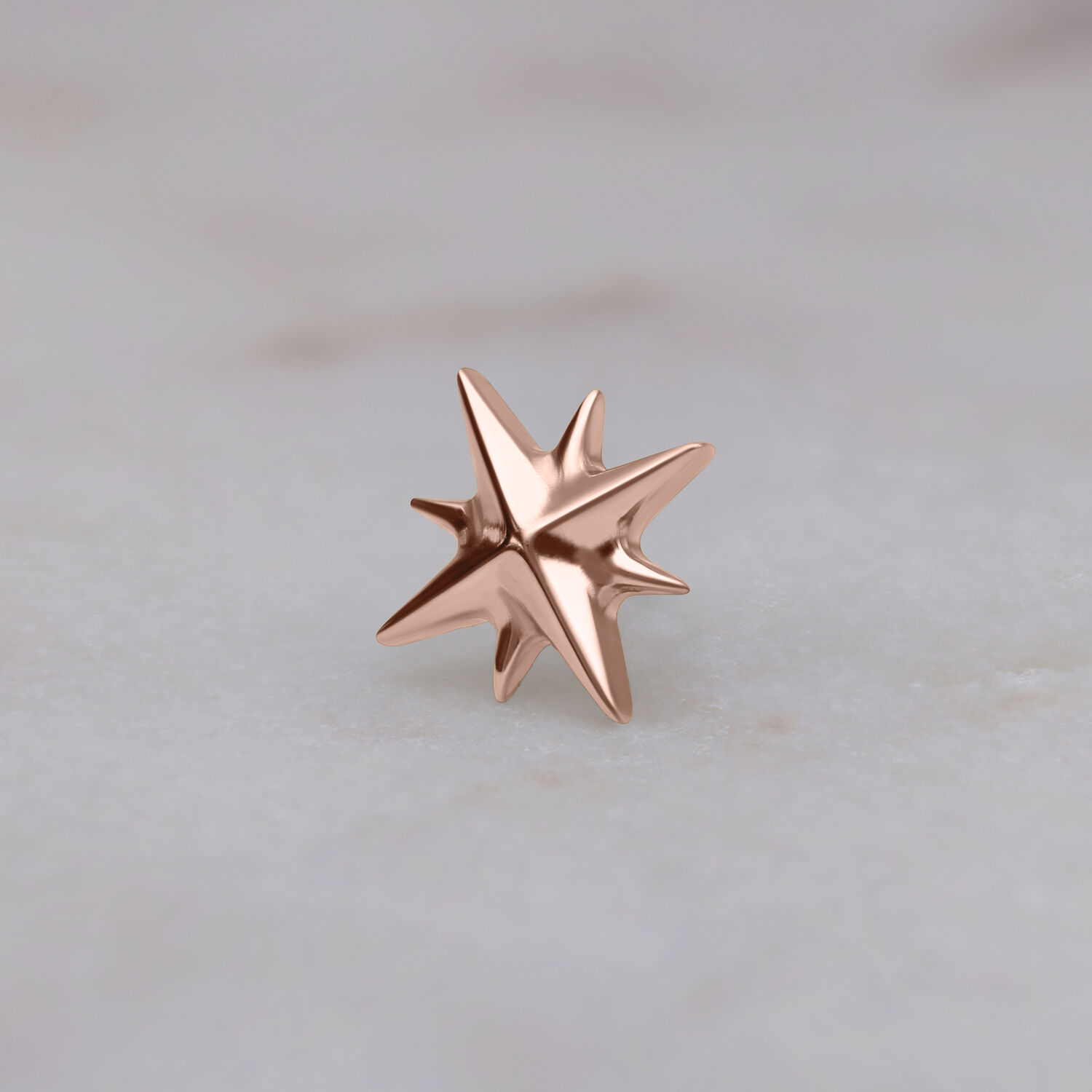 Stella in oro rosa per Push Fit su sfondo chiaro