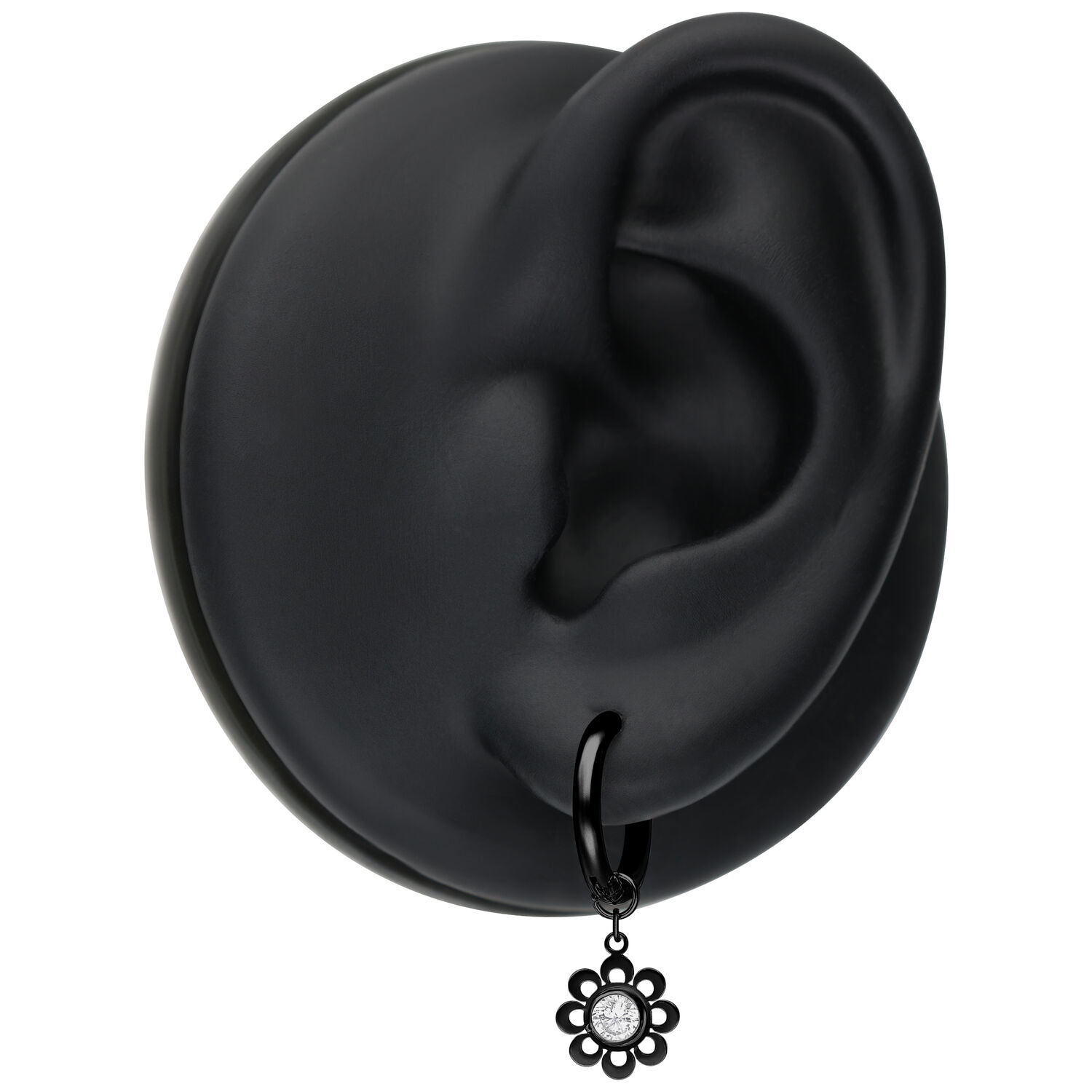 Orecchini Mini Crystal Flower Neri su un modello di orecchio nero su sfondo bianco