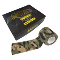 Benda Grip Camouflage accanto a confezione nera con scritta gialla