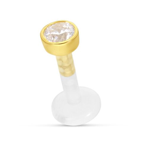 Labret con montatura dorata e cristallo chiaro su sfondo bianco