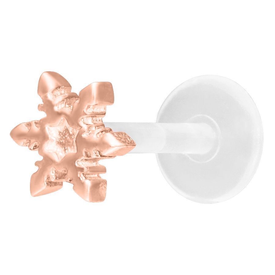 Labret in oro rosa con fiocco di neve su sfondo bianco