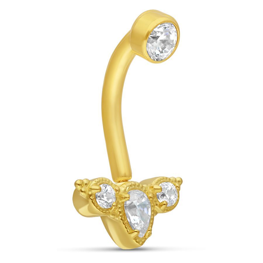 Piercing a banana in oro con cristalli chiari su sfondo bianco