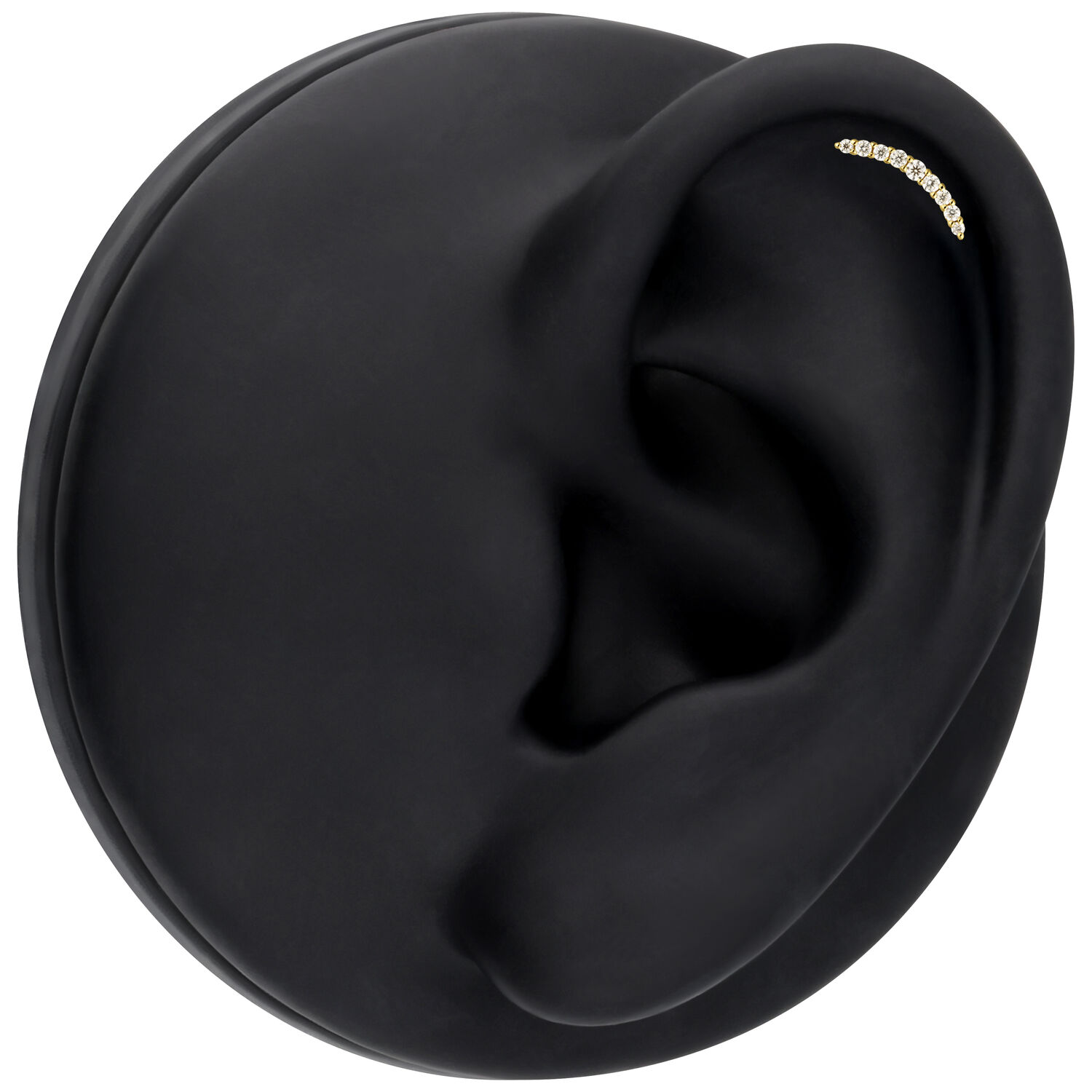 Inserto dorato con cristalli di moissanite in un display nero per orecchio