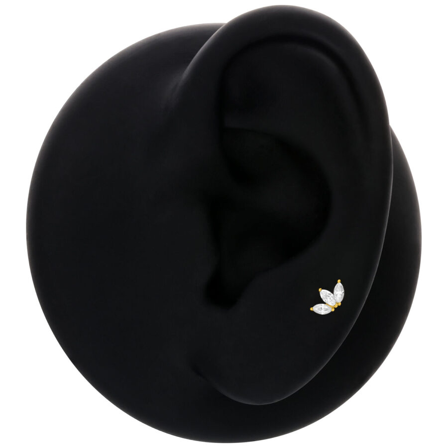 Inserto Lotus dorato con cristallo nell'orecchio su sfondo nero