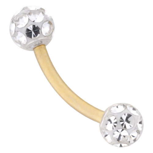 Piercing all'ombelico in oro con due sfere cristalline su sfondo bianco