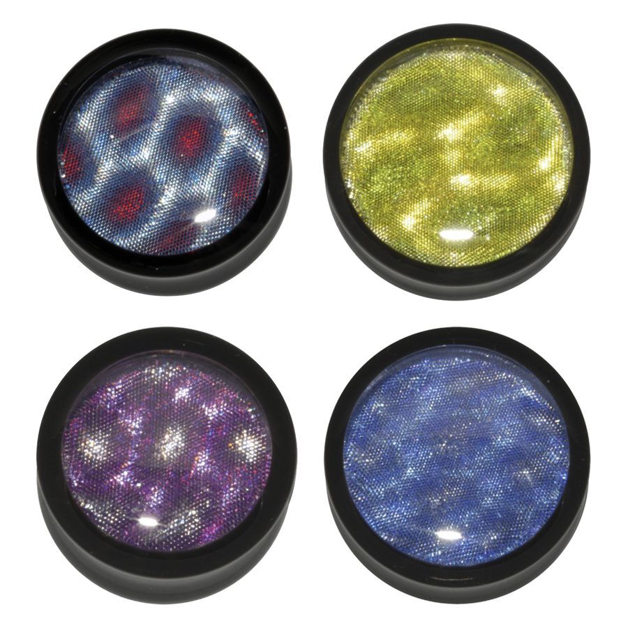 Bunte PMMA Plugs von Wildcat Vier runde PMMA Plugs in Blau, Lila, Gelb und Schwarz auf weißem Hintergrund