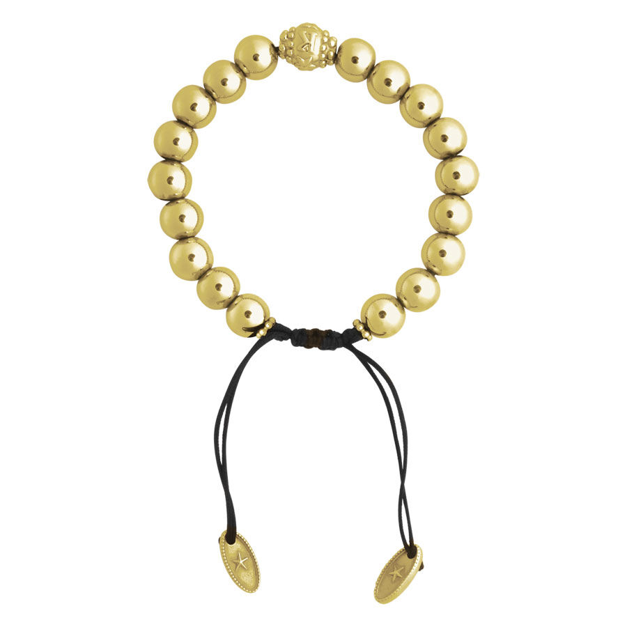 Bracciale dorato con perle rotonde e cinturino nero su sfondo bianco