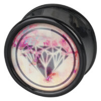 Plug nero con design a diamante Plug nero rotondo con motivo a diamante rosa su sfondo bianco
