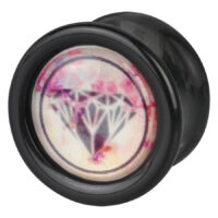 Plug nero con design a diamante Plug nero rotondo con motivo a diamante rosa su sfondo bianco