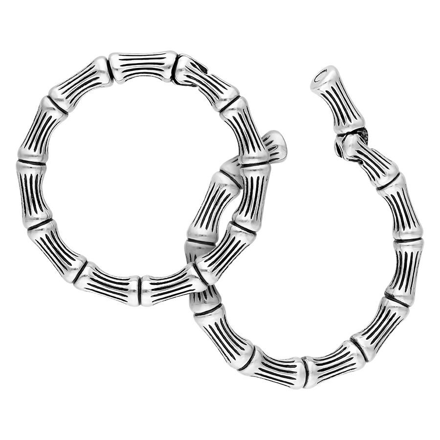 Orecchini a pesi Bonechain in acciaio chirurgico argento su sfondo bianco