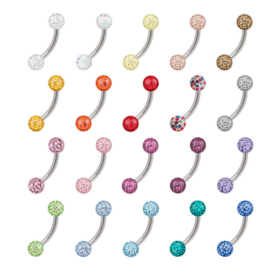 Verschiedene bunte Bananabells aus Titan mit Kristallen auf weißem Hintergrund