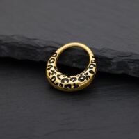 Clicker per setto dorato con motivo leopardato su sfondo nero