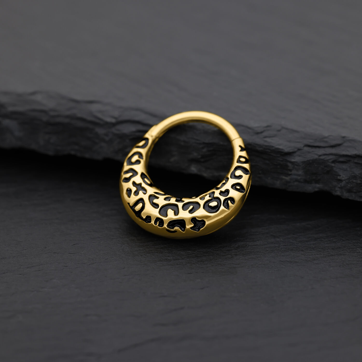Clicker per setto dorato con motivo leopardato su sfondo nero
