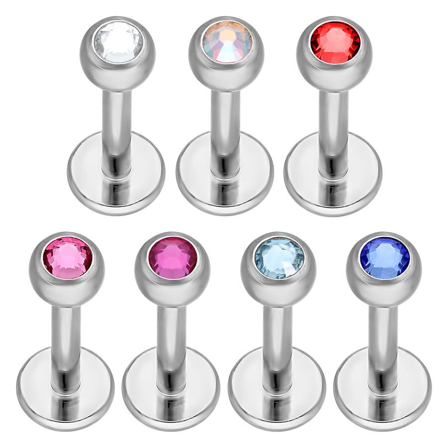 Labret in titanio argentato con cristalli chiari, rossi, rosa e blu su sfondo bianco
