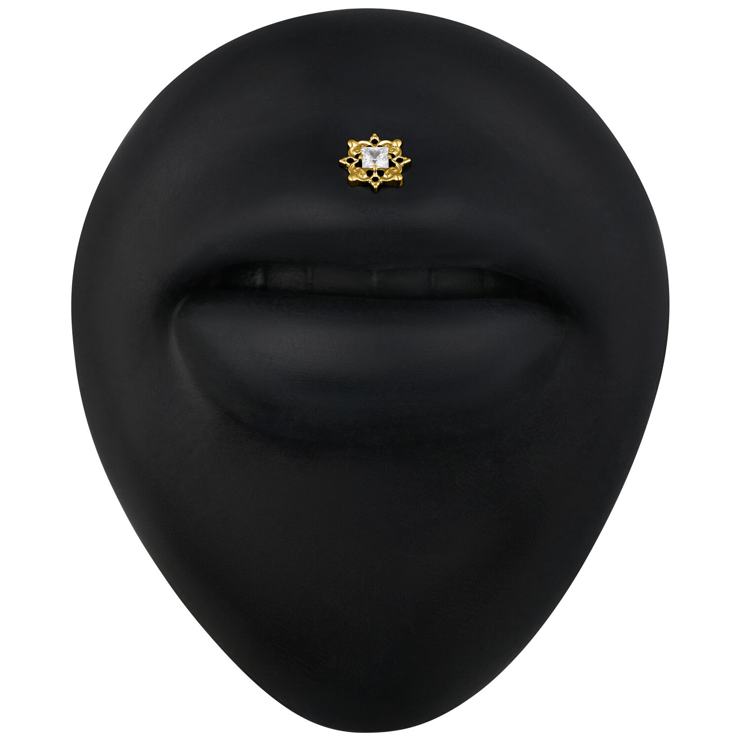 Accessorio in metallo dorato con cristallo chiaro su sfondo nero