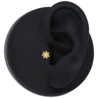 Inserto per piercing dorato Push Fit Inserto per piercing dorato Push Fit con cristallo su sfondo nero