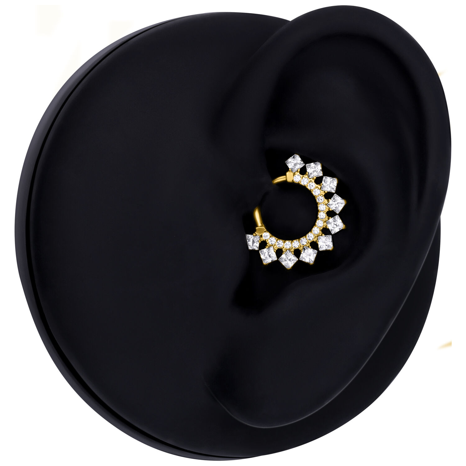 Goldener Septum Clicker mit Kristallen auf schwarzem Hintergrund
