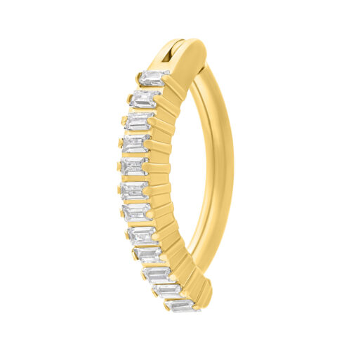Clicker per ombelico dorato con cristalli chiari su sfondo bianco