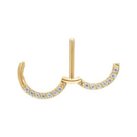 Clicker capezzolo dorato con cristalli chiari su sfondo bianco