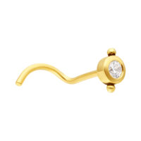 Piercing al naso in oro 18K con cristallo chiaro Piercing al naso dorato con cristallo chiaro su sfondo bianco