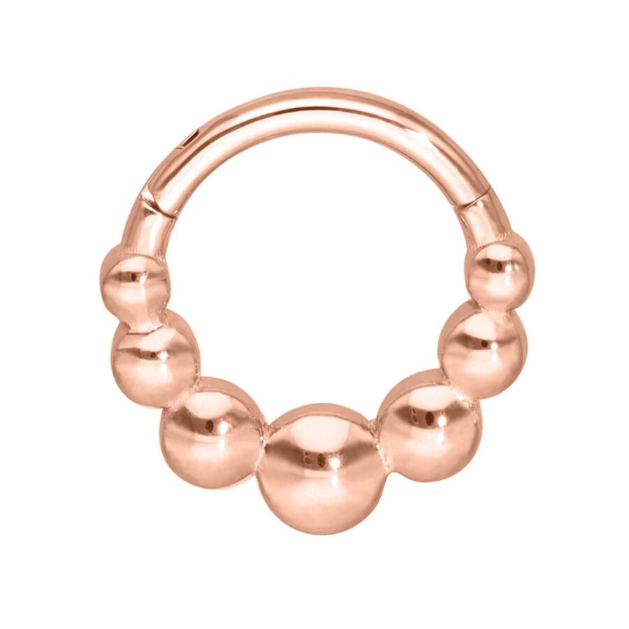 Anello piercing in oro rosa con palline su sfondo bianco
