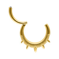 Clicker septum dorato con punte su sfondo bianco